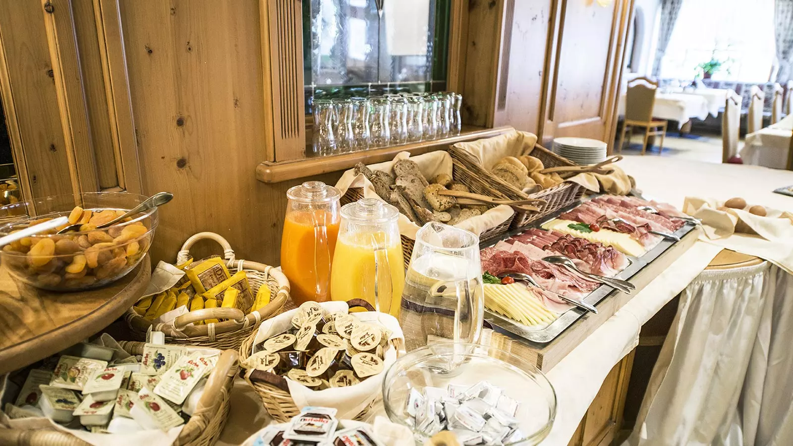 Rich breakfast buffet at our hotel in Val Casies with numerous juices, sweets, cold cuts and jams.