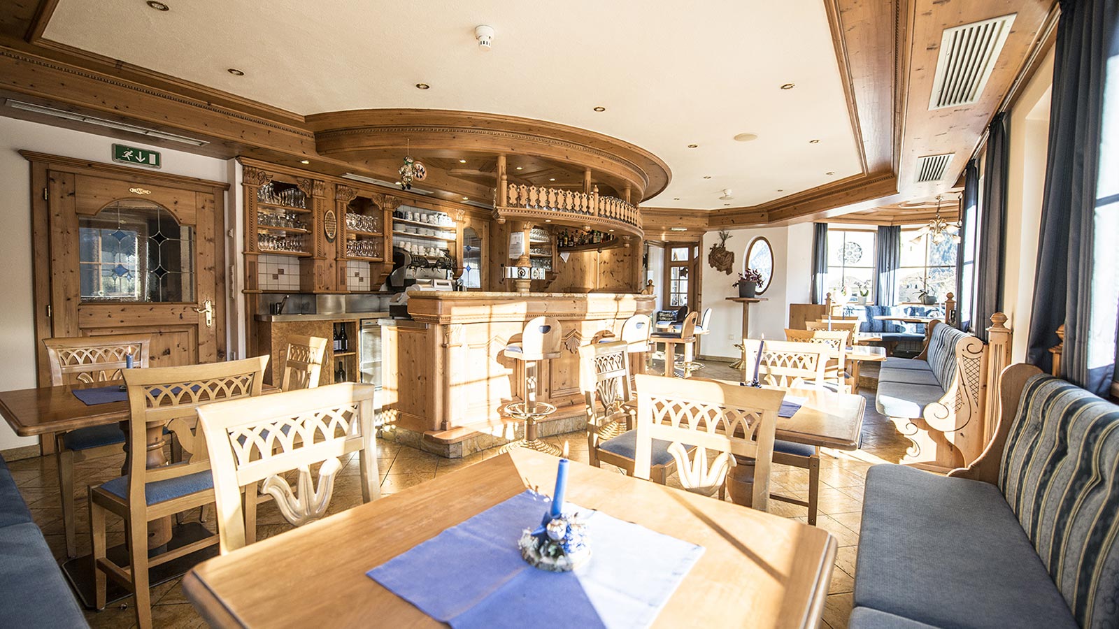 The solid wood bar at the Hotel Gschwendt in Val Casies with the light entering through the windows